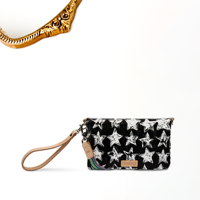 Black clutch with white star pattern and beige strap on a white background
