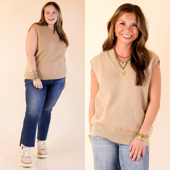 two women wearing a taupe sweater vest with blue jeans on a plain background