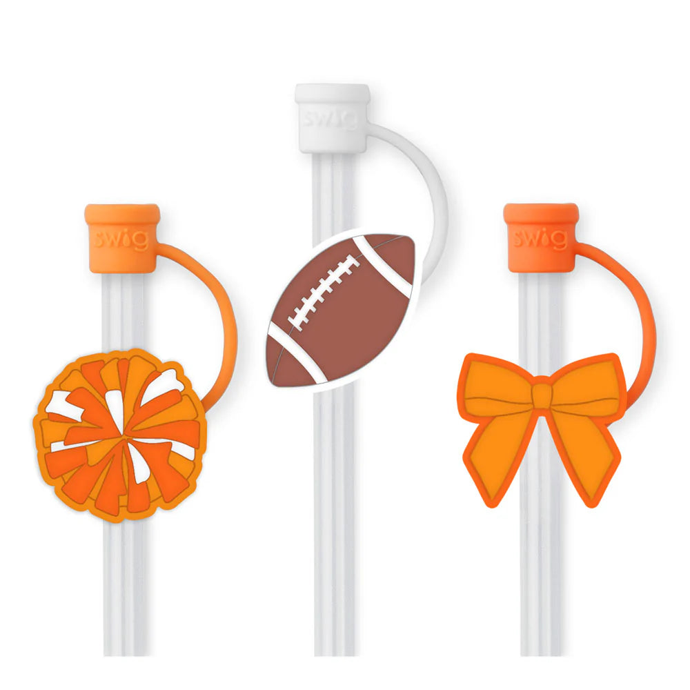 Clear straws with orange ends and decorative attachments on a white background