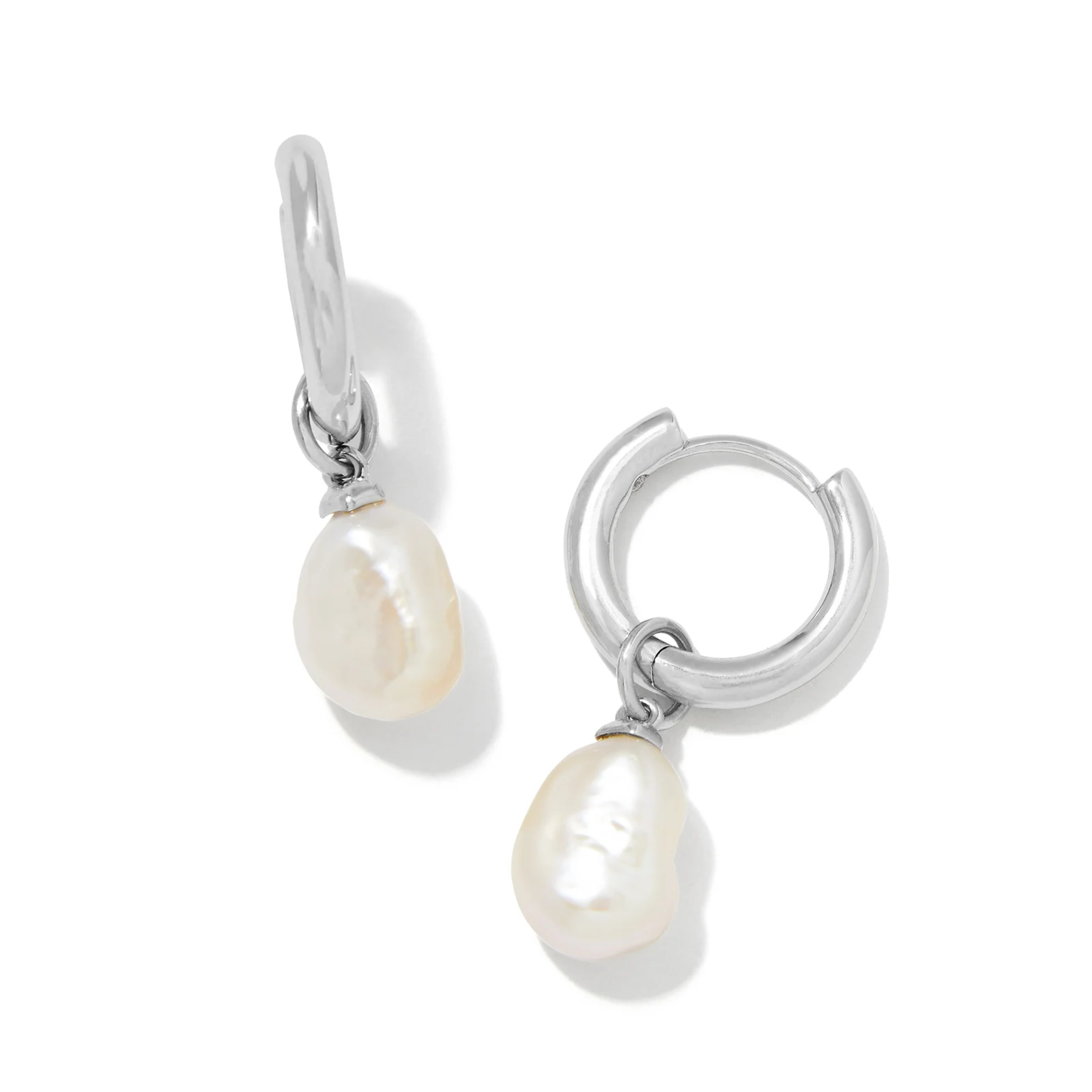 These willa Silver Pearl Huggie earrings in White Pearl by Kendra Scott are pictured on a white background.
