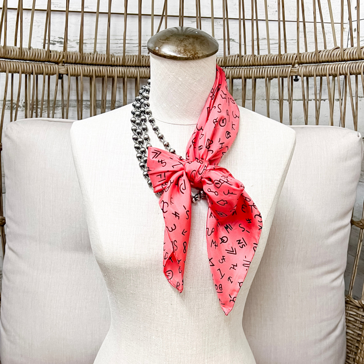 Wyoming Traders | Branded Print Silk Wild Rag Scarf in Coral