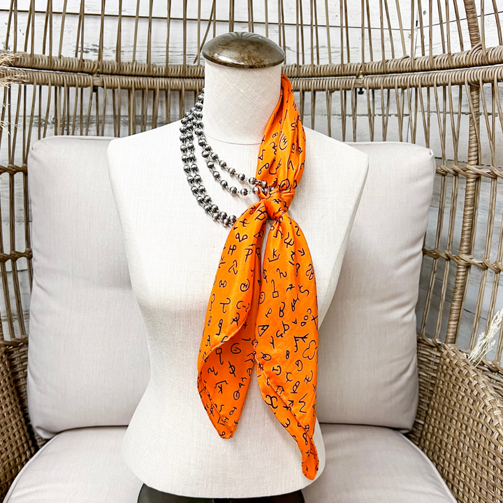 Wyoming Traders | Branded Print Silk Wild Rag Scarf in Orange