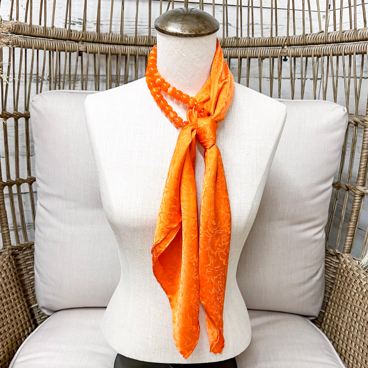 Wyoming Traders | Jacquard Print Silk Wild Rag Scarf in Orange