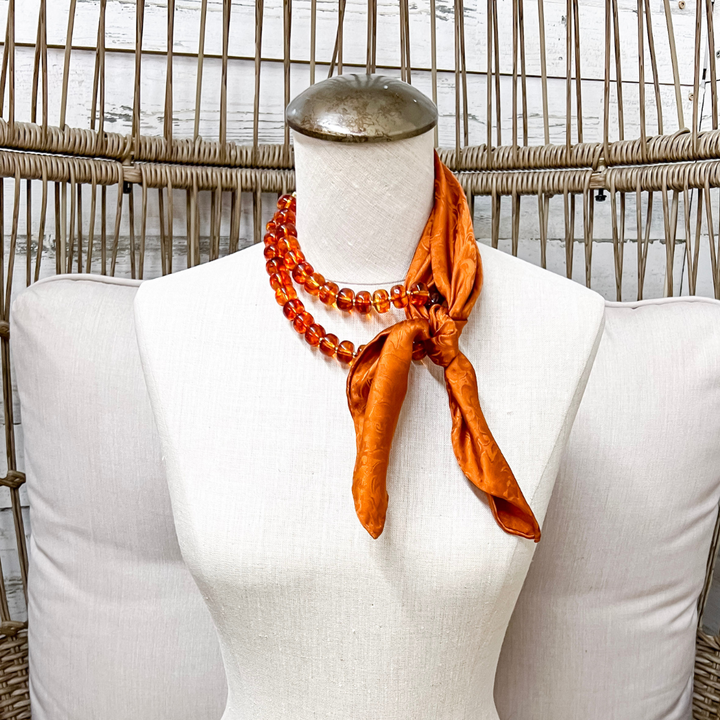 Wyoming Traders | Mini Jacquard Print Silk Wild Rag Scarf in Copper Orange