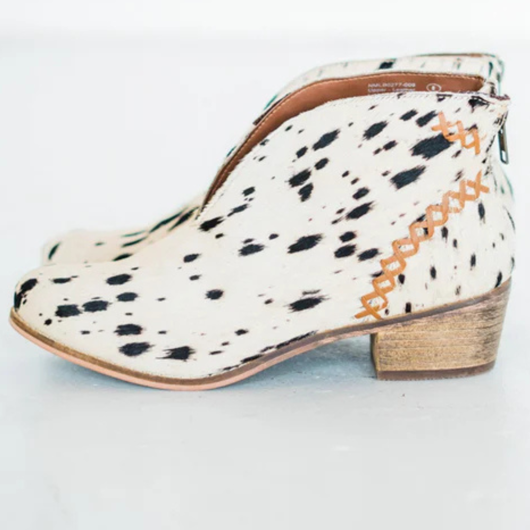 Online Exclusive | All Roads Bootie in Black and White Cow Print