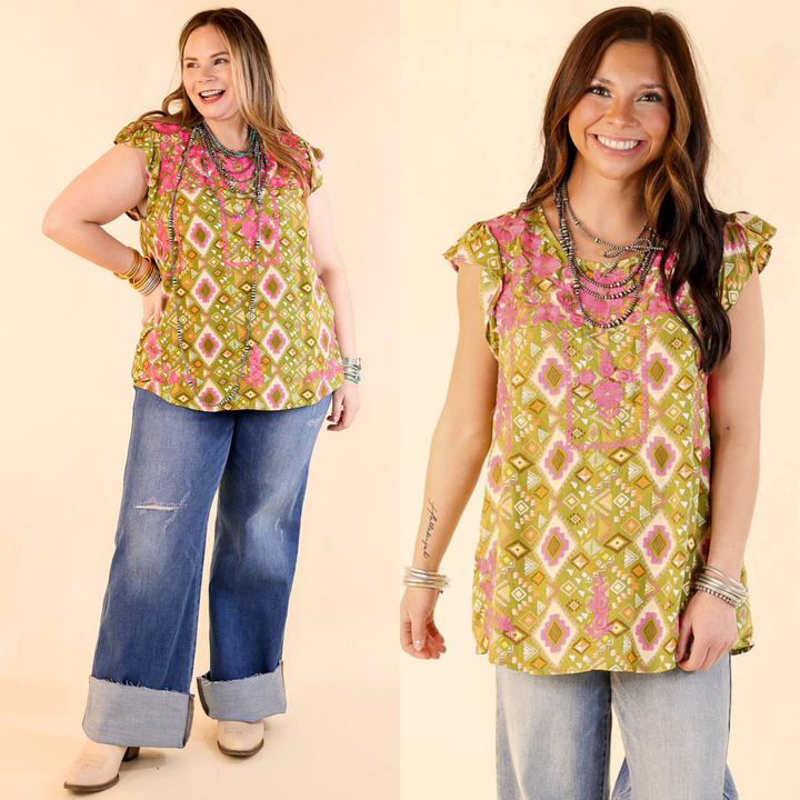 Two women modeling multicolored top with Aztec print and pink floral embroidery with jeans. 