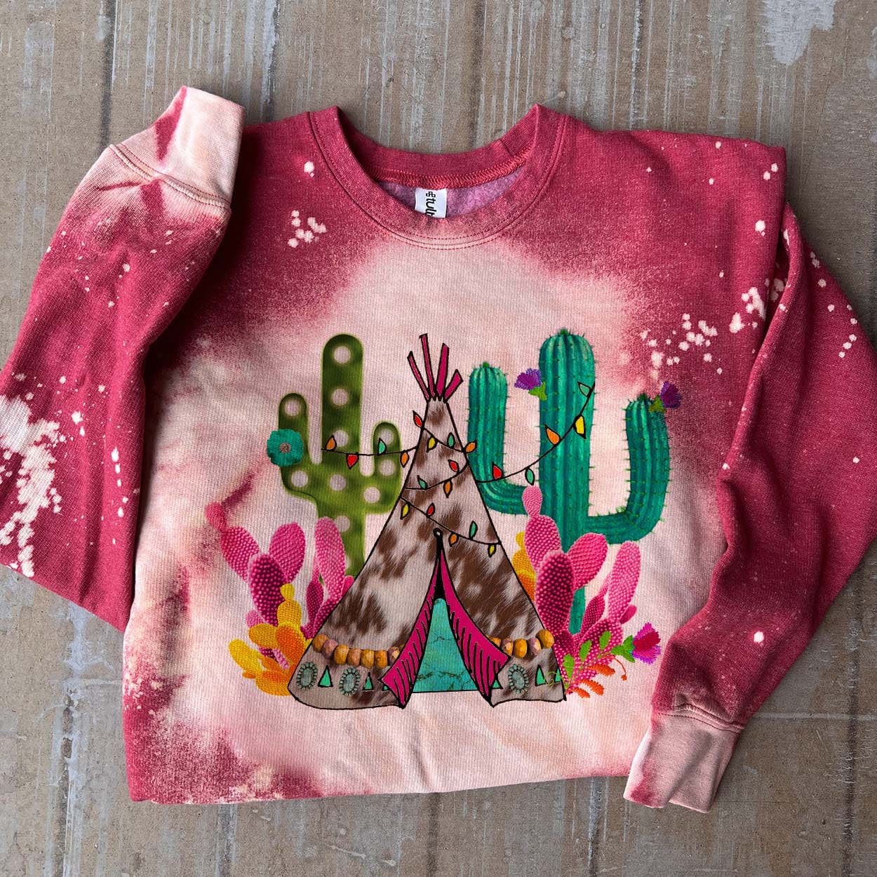 Online Exclusive | Cactus Teepee With Lights Long Sleeve Bleached Splatter Graphic Sweatshirt in Red - Giddy Up Glamour Boutique