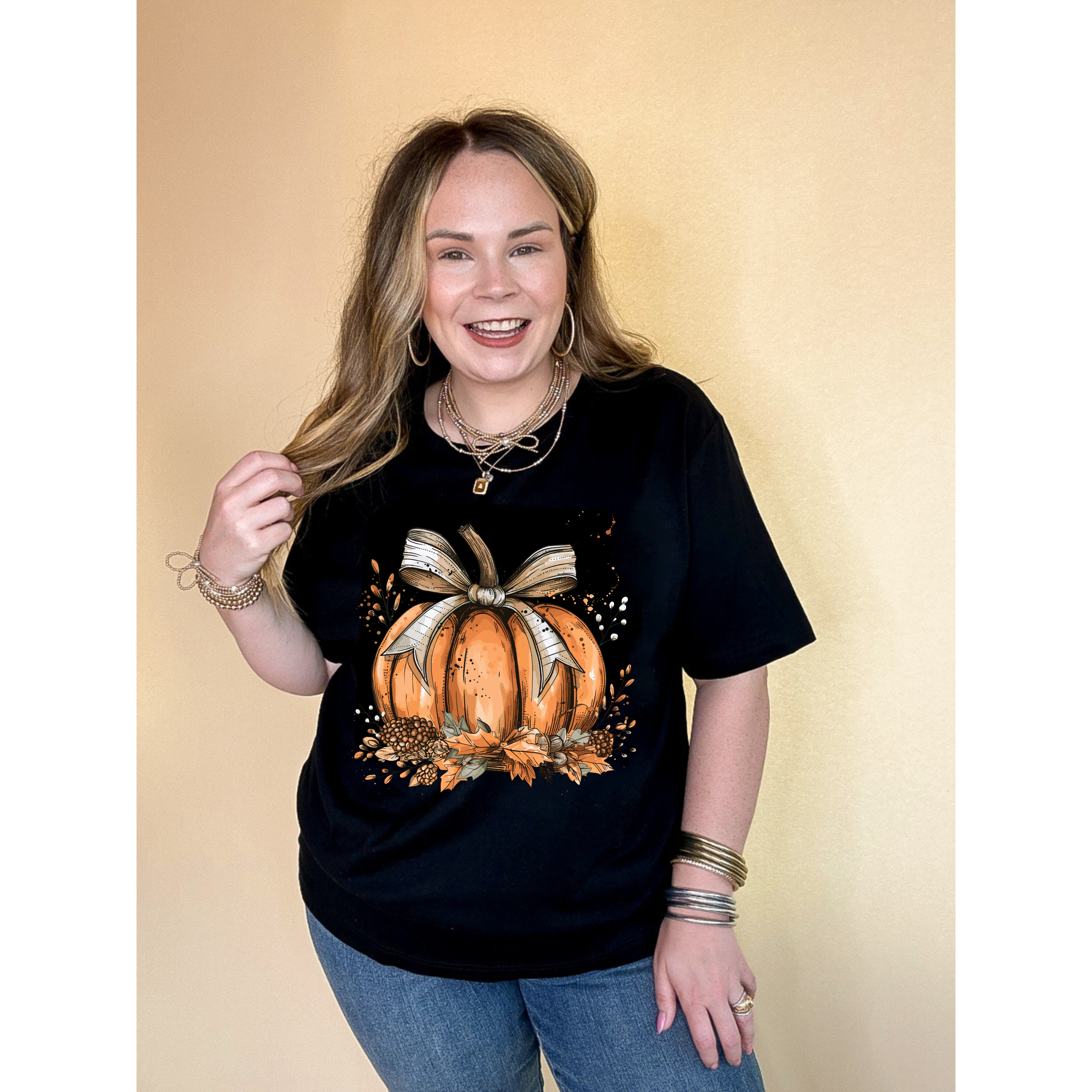 Online Exclusive | Chic Autumn Pumpkin on a Bed of Leaves with White Bow Graphic Tee in Multiple Color Options