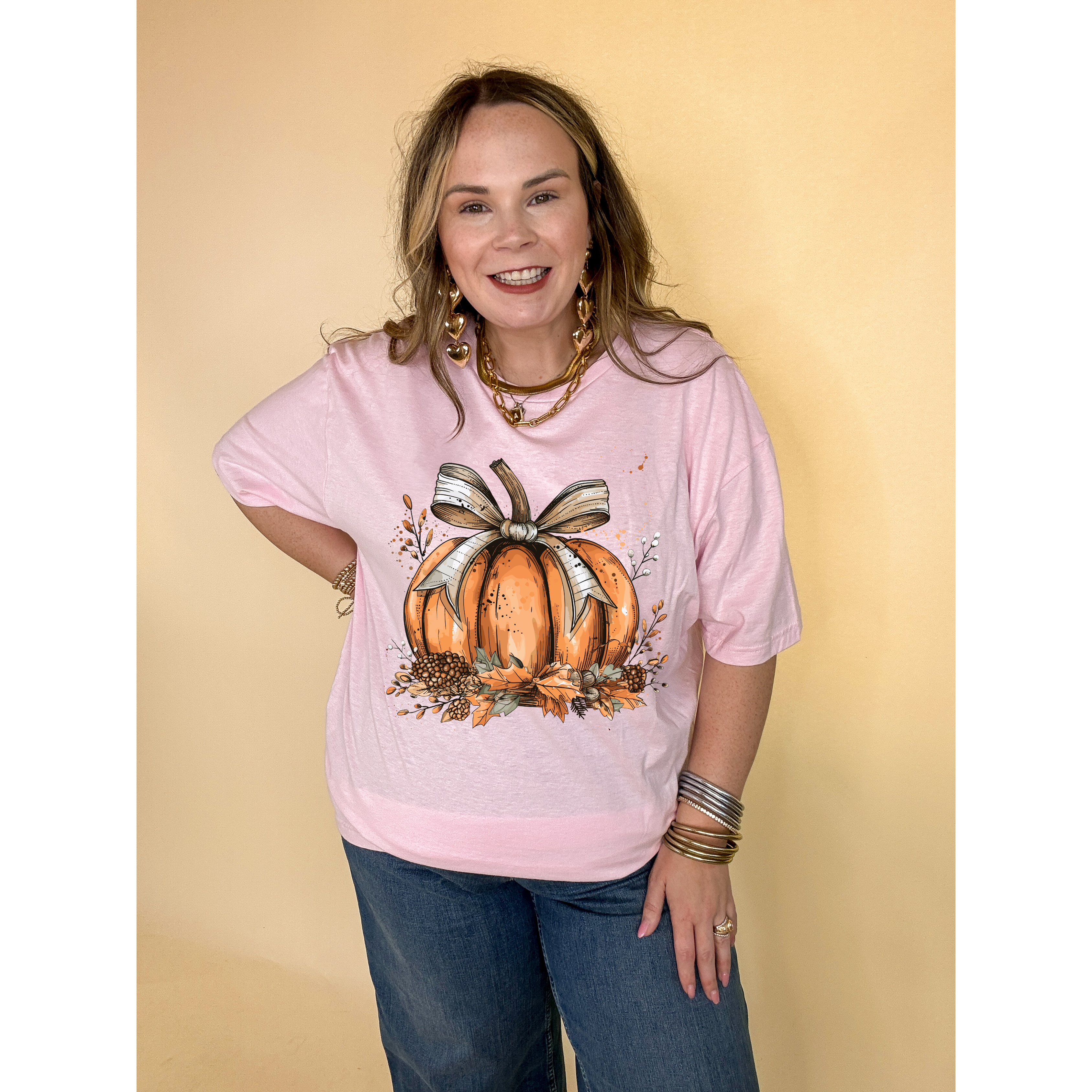 Online Exclusive | Chic Autumn Pumpkin on a Bed of Leaves with White Bow Graphic Tee in Multiple Color Options