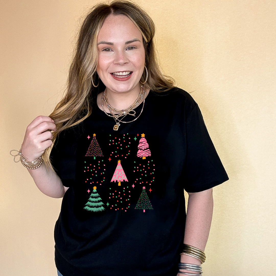 Online Exclusive | Variety of Christmas Trees and Christmas Lights Bow Collage Graphic Tee in Multiple Color Options