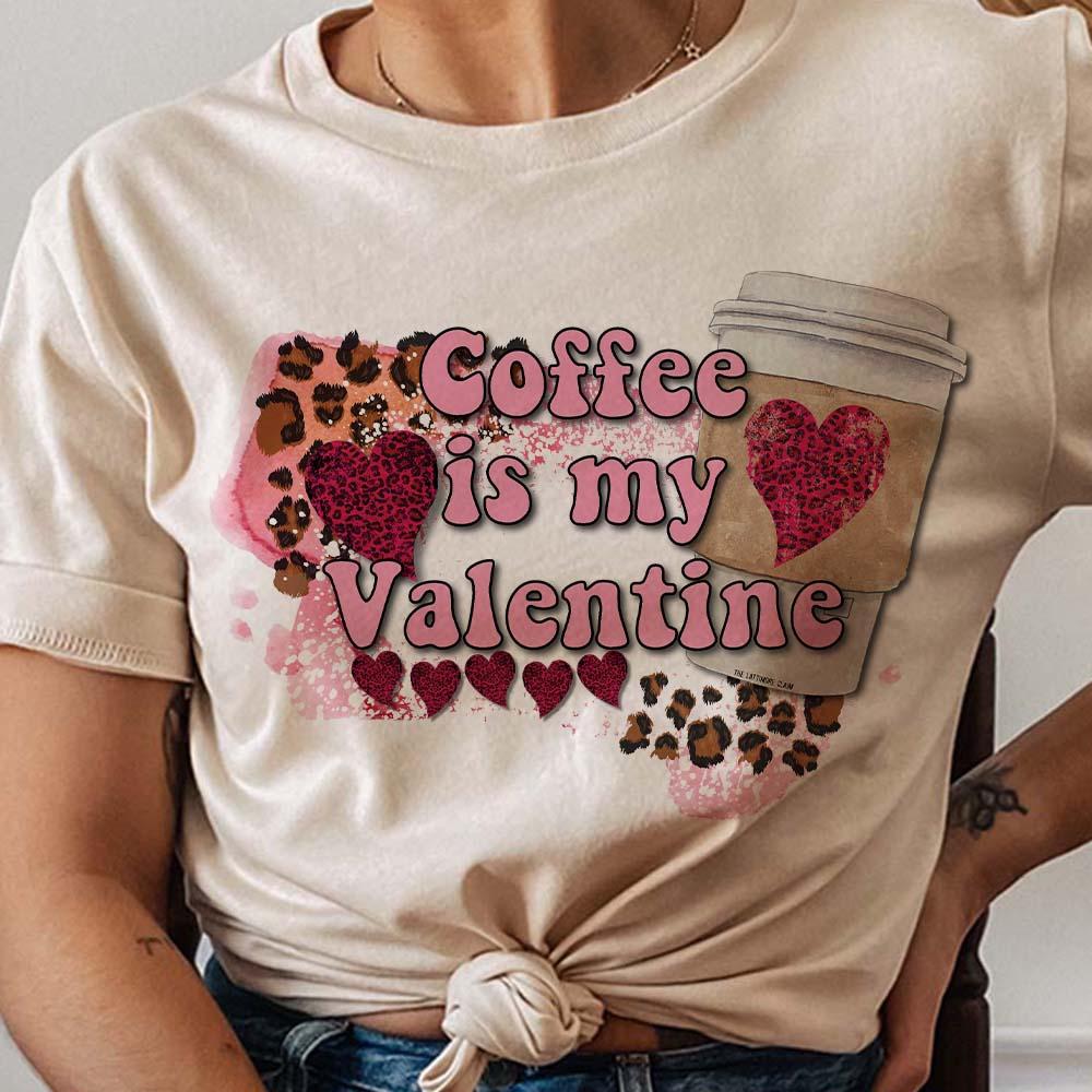 Model is wearing a graphic tee that says "Coffee is my valentine." This tee is knotted in the front with leopard print and heart detailing.