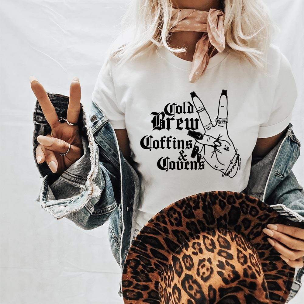 Online Exclusive | Cold Brew, Coffins, and Covens Short Sleeve Graphic Tee in White - Giddy Up Glamour Boutique