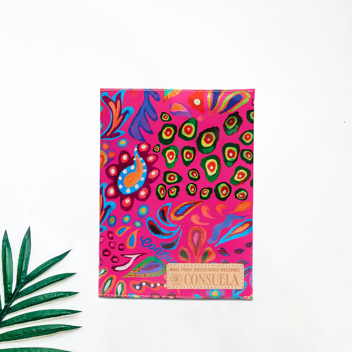 white background with tropical leaf for decor featuring the famous sophie consuela cloth in a new color way: Pink! The pink consuela cloth background has fun and colorful paisley and fun print on the exteror. this notebook is perfect for school.