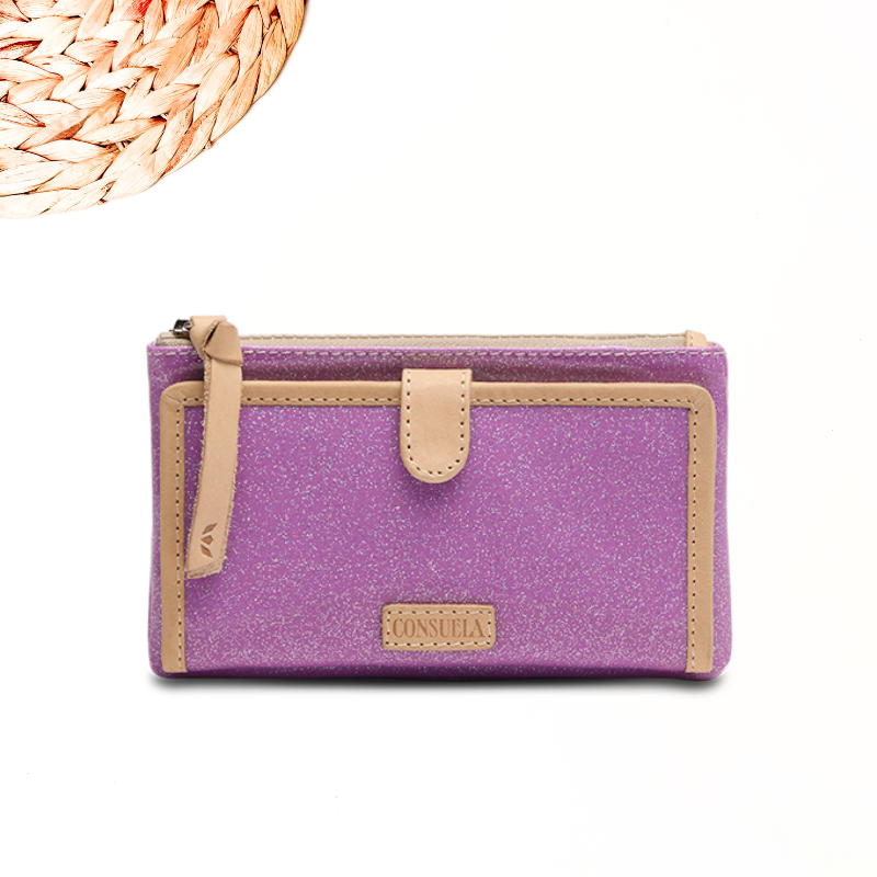 white background with circle wooden detailing featuring a purple glitter wallet in consuela cloth