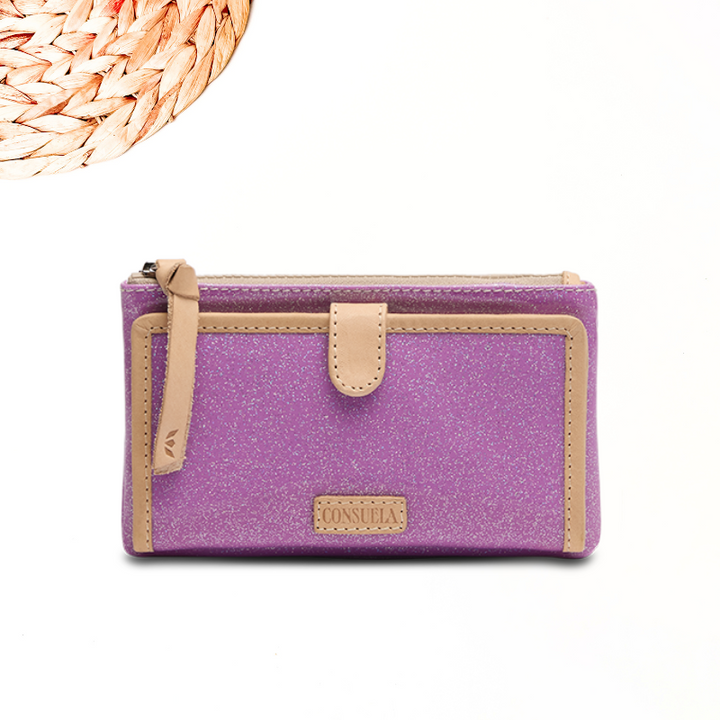 white background with circle wooden detailing featuring a purple glitter wallet in consuela cloth