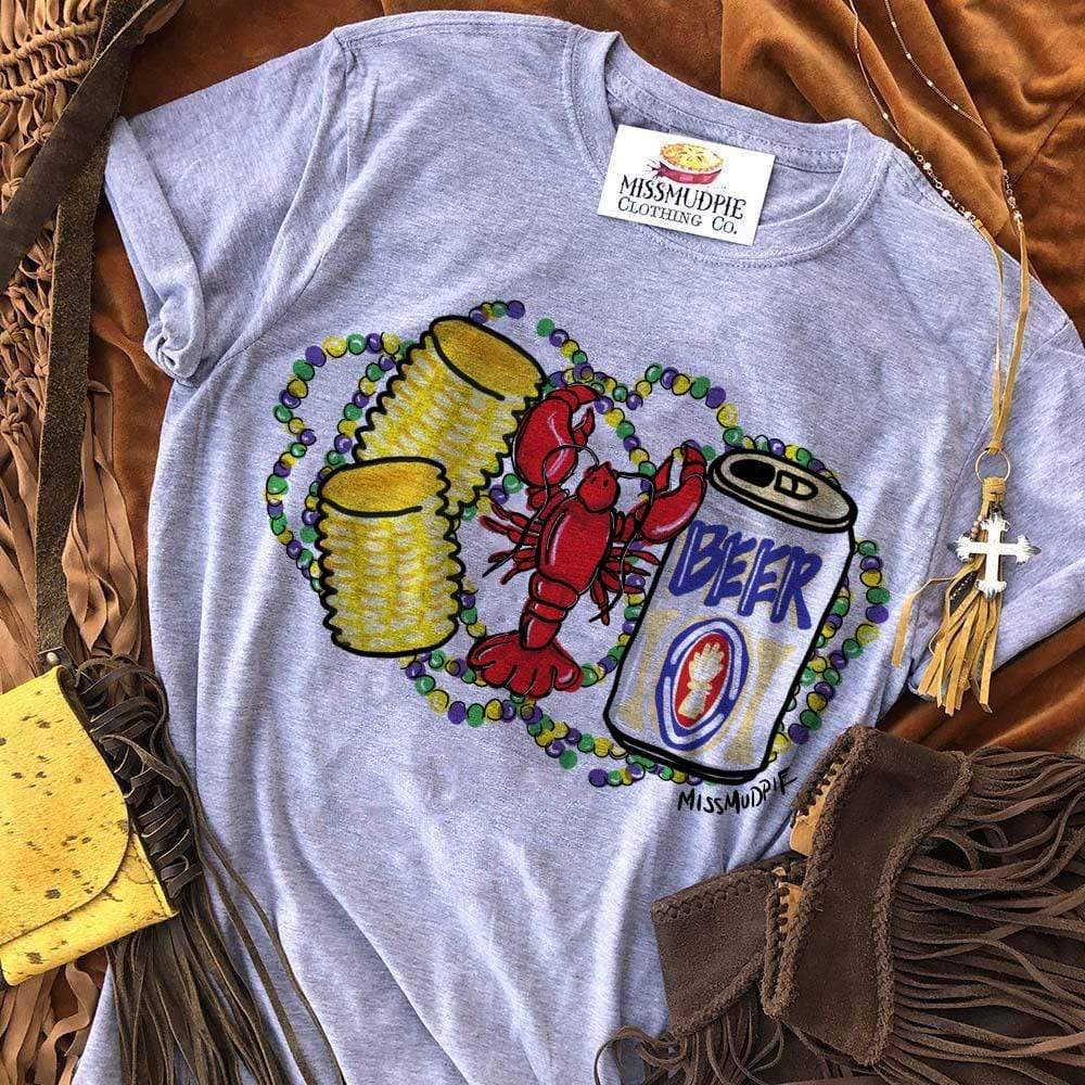 A heather grey short sleeve tee featuring a graphic of a red crawfish with two corn on the cobs and a beer. Behind the crawfish are purple, green, and yellow mardi gras beads