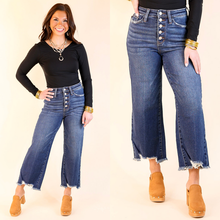 These cropped wide-leg jeans feature a flattering high waist and a trendy button fly design. They come in a medium wash.