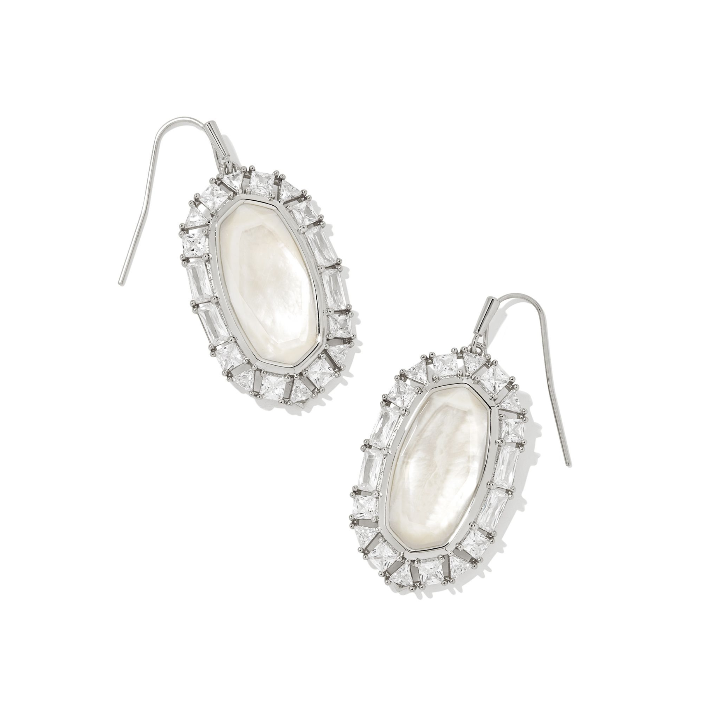 Silver, clear crystal frame drop earrings with ivory mother of pearl center stone pictured on a white background.