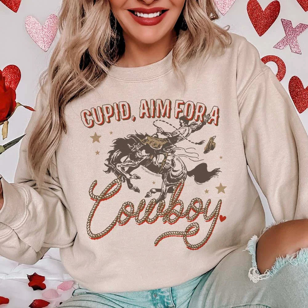 Online Exclusive | Cupid, Aim For A Cowboy Long Sleeve Graphic Sweatshirt in Cream - Giddy Up Glamour Boutique