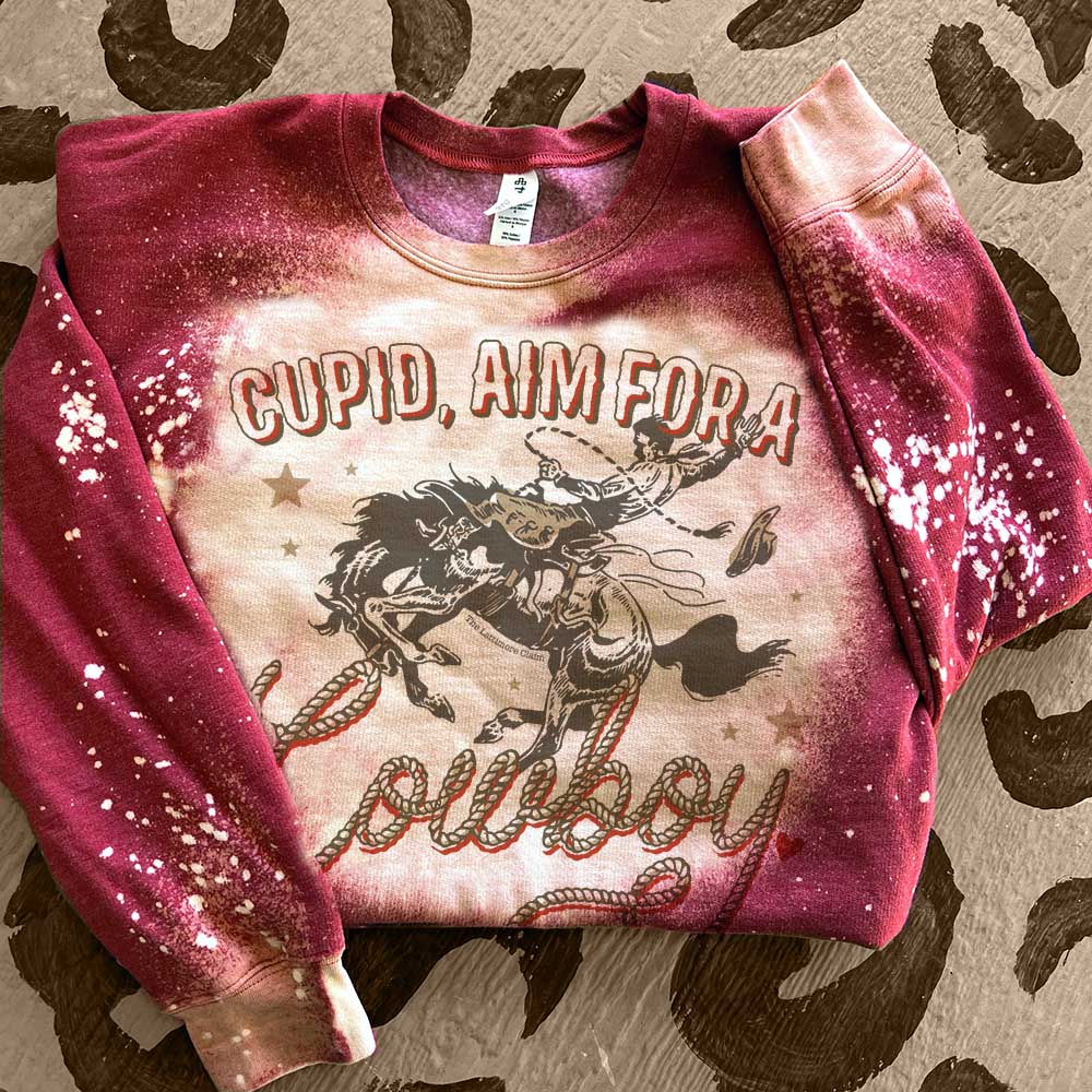 Online Exclusive | Cupid, Aim For A Cowboy Long Sleeve Graphic Sweatshirt with Bleach Splatter in Red - Giddy Up Glamour Boutique