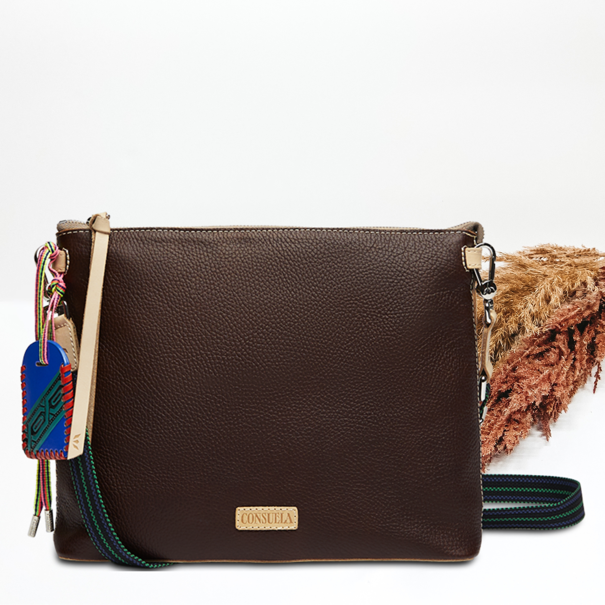 Brown, downtown crossbody pictured on a white background. 