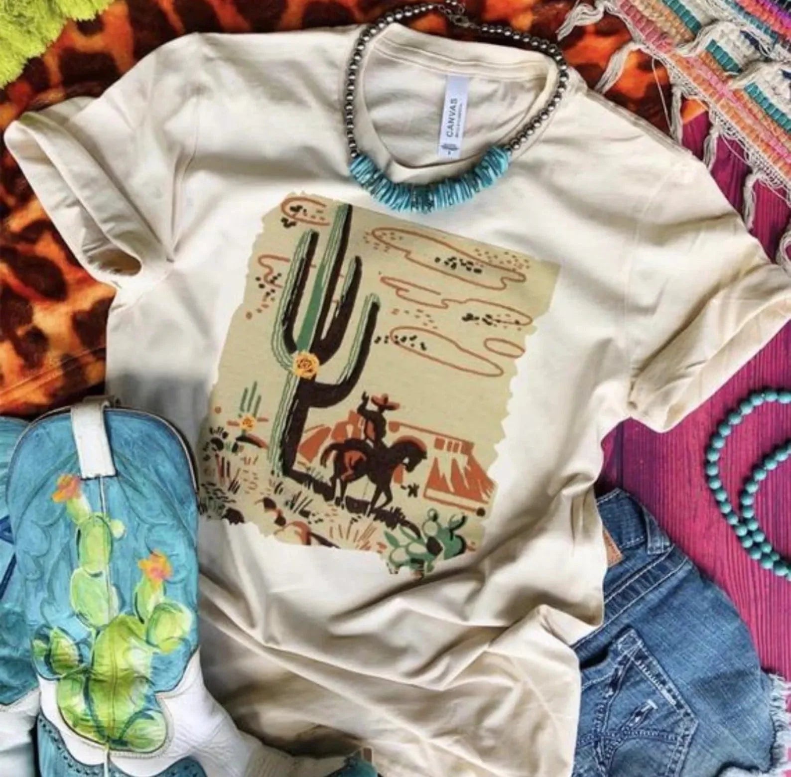 Online Exclusive | Desert Cowboy Drawing Short Sleeve Graphic Tee in Cream - Giddy Up Glamour Boutique