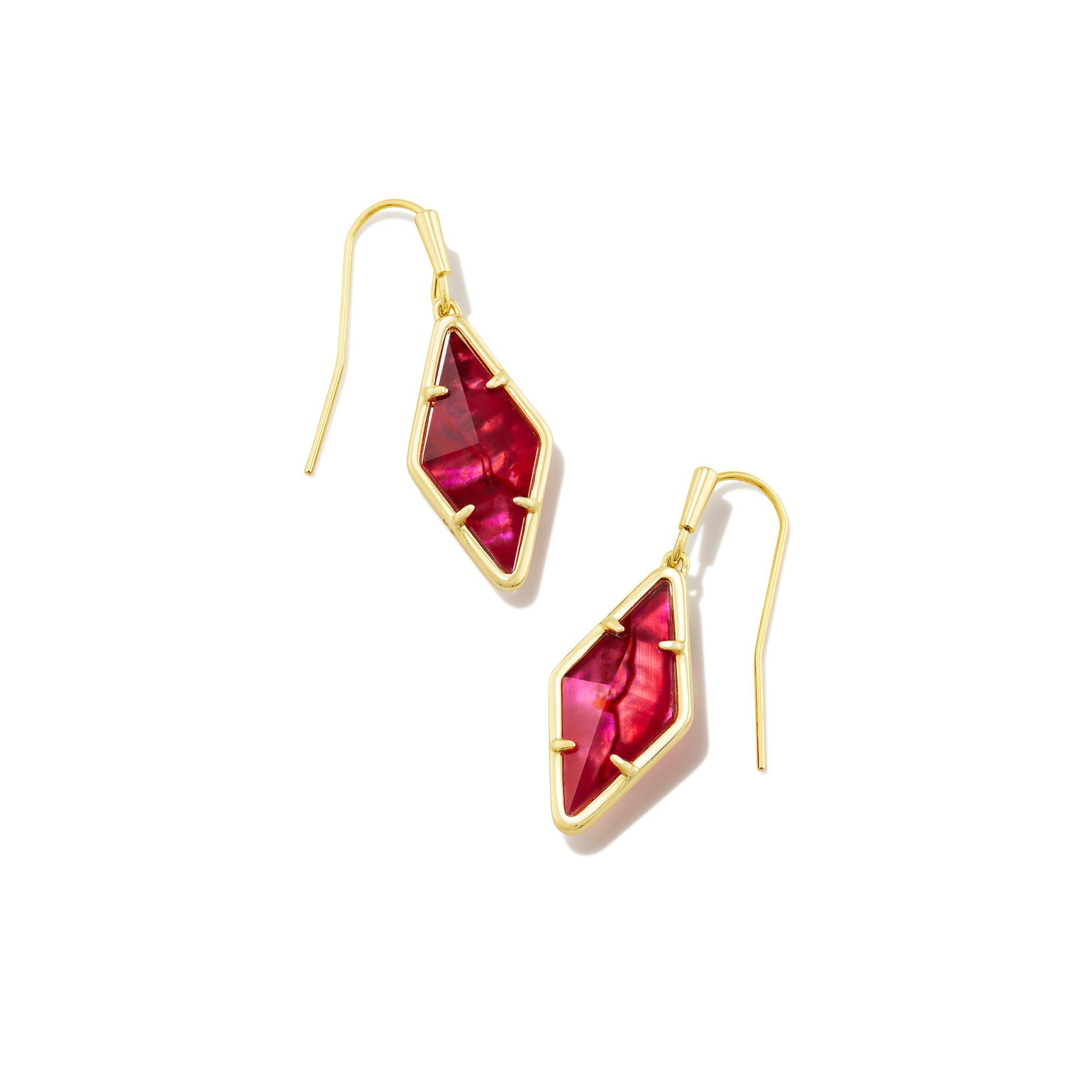 Gold, fish hook diamond drop earrings with a raspberry illusion stone pictured on a white background.