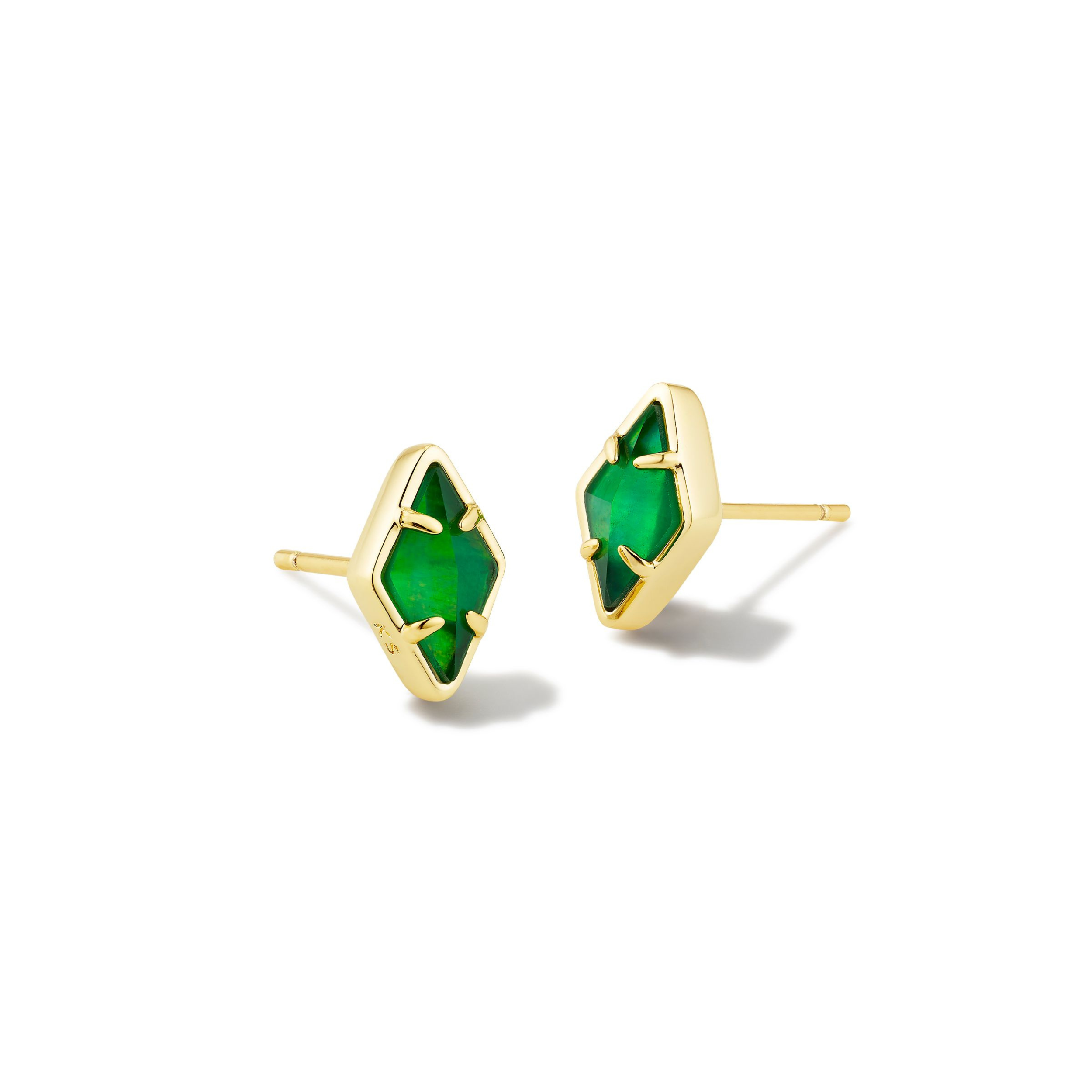Pictured on a white background is a pair of gold, diamond shaped stud earrings with kelly green stones. 