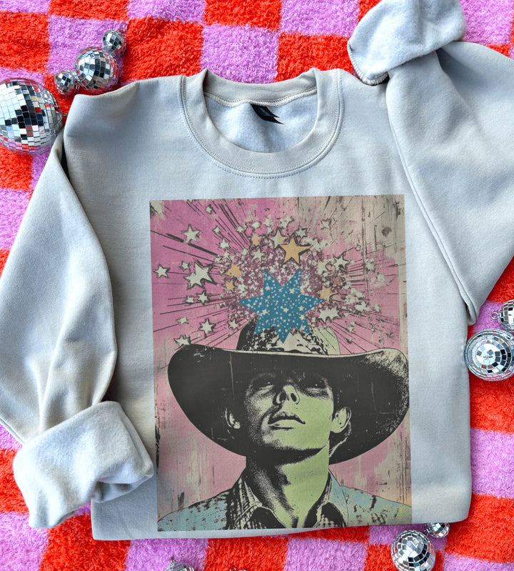 Legends Never Die graphic tee with retro cowboy & starburst pop-art design – cream sweatshirt