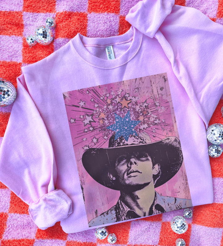 Legends Never Die graphic tee with retro cowboy & starburst pop-art design – pink sweatshirt