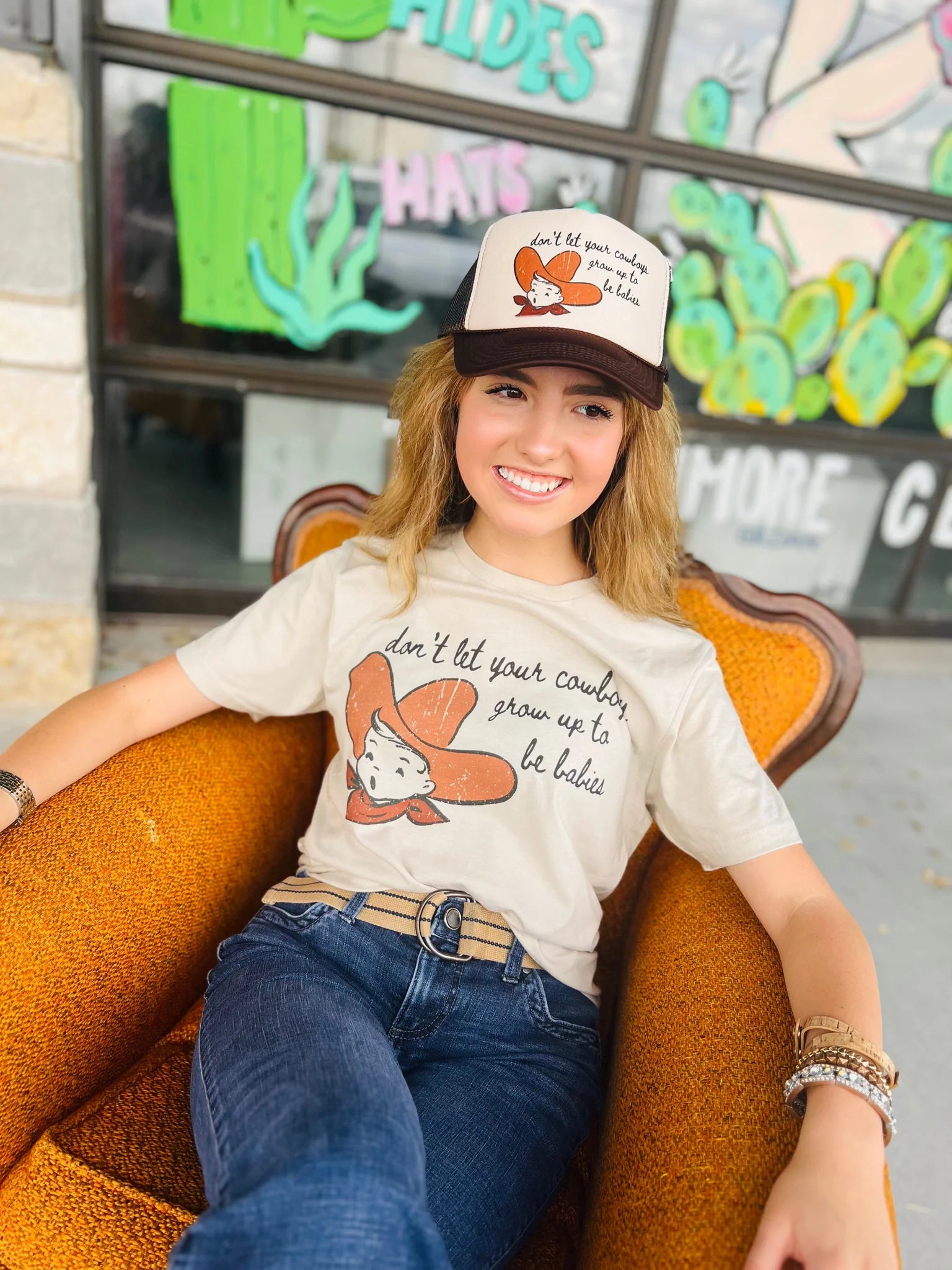 Online Exclusive |Don't Let Your Cowboys Grow Up To Be Babies Graphic Tee in Cream - Giddy Up Glamour Boutique