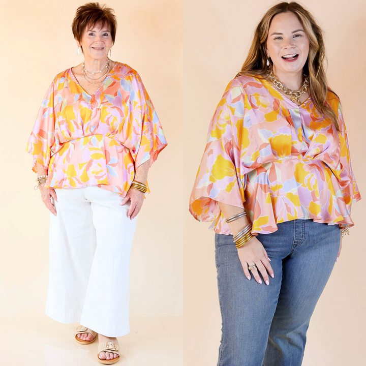 v neck top with drop sleeves and a cinched waistband with a colorful mosaic print. Featuring a plus size model.