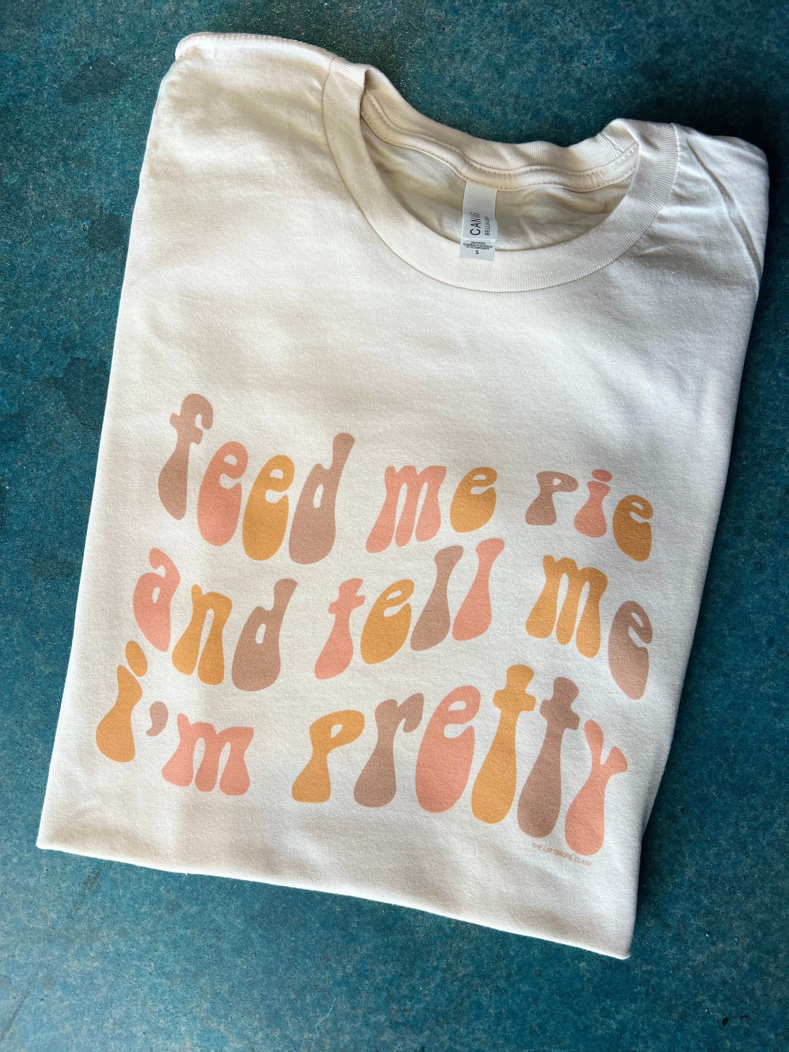 Online Exclusive | Feed Me A Pie And Tell Me I'm Pretty Short Sleeve Graphic Tee in White - Giddy Up Glamour Boutique