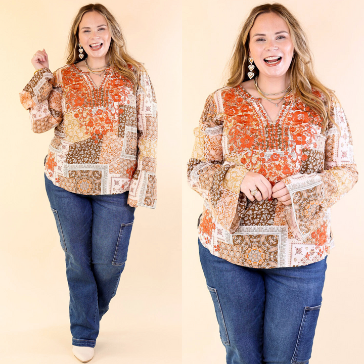 Model wearing the Everything Counts Floral Embroidered Top. The top features rust orange embroidery and paisley floral prints.