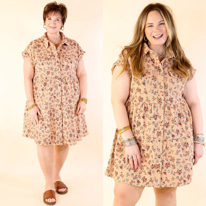 Two models wearing a beige floral corduroy dress with short sleeves and a collared neckline. 
