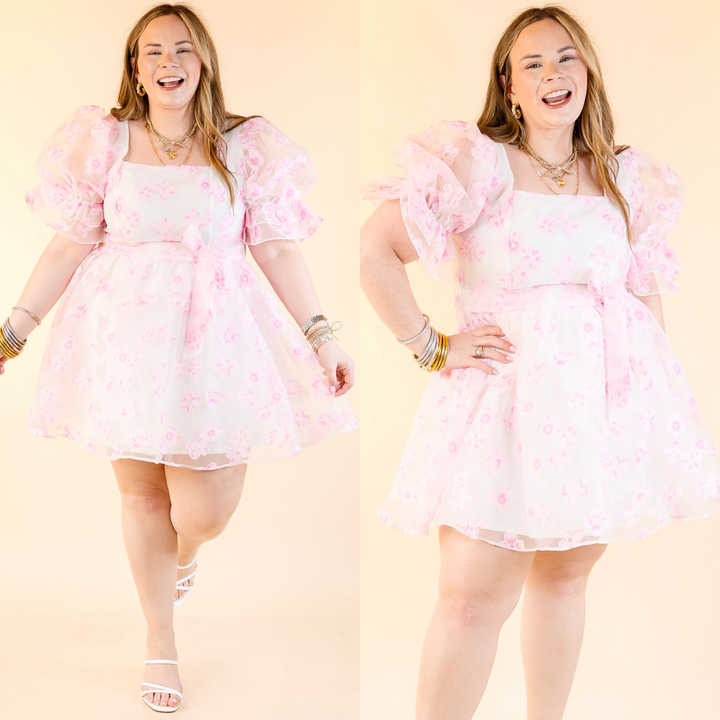 This dress features short puff sleeves, a flattering square neckline, floral print, and an adjustable belt. 