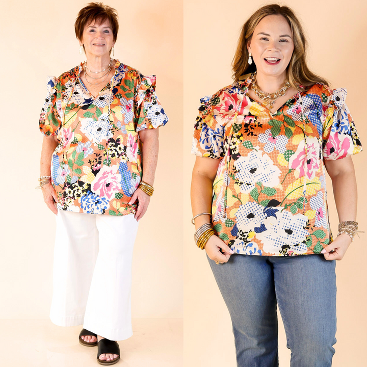 v neck top with tie closure, short puff sleeves, and a floral print. 