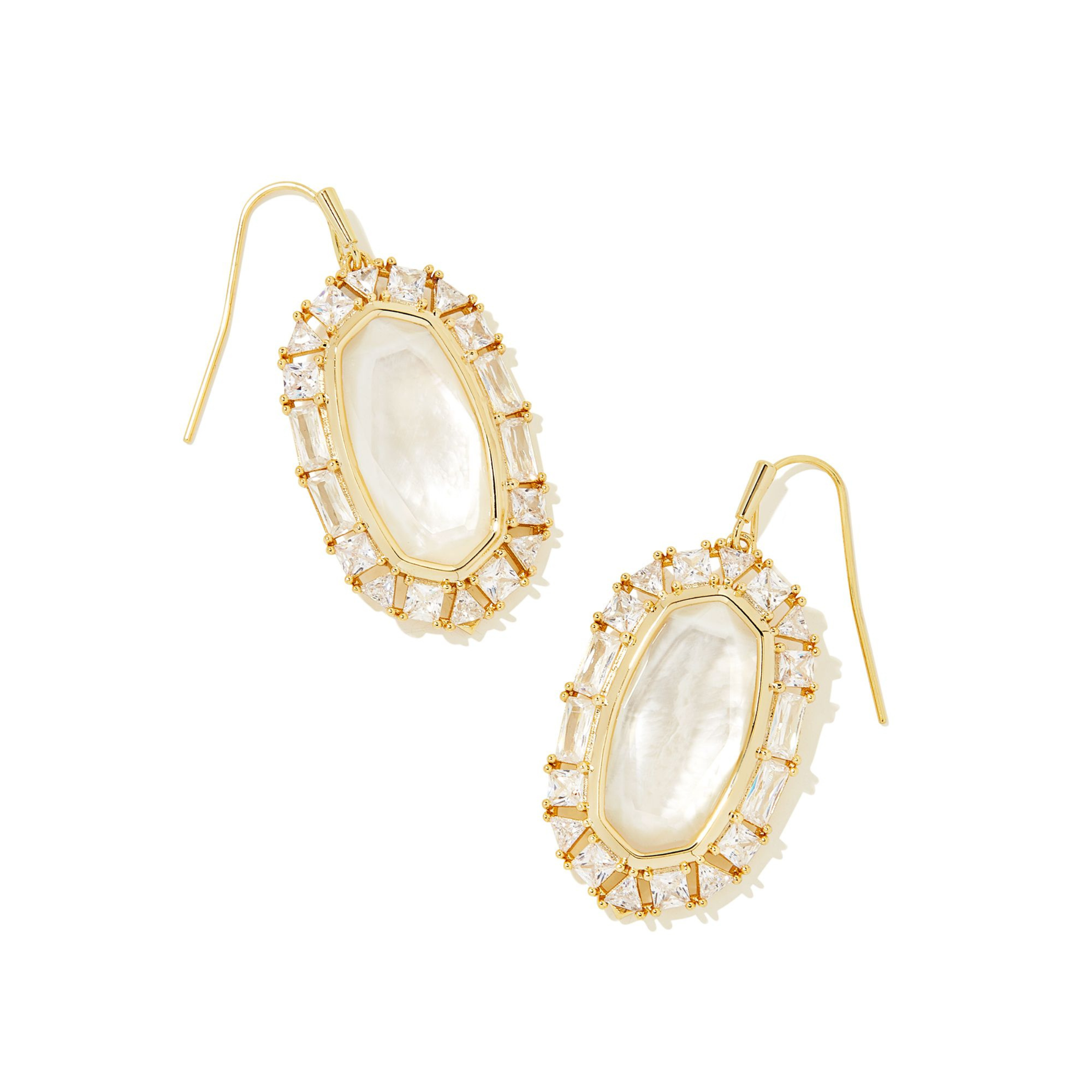 Gold, clear crystal frame drop earrings with ivory mother of pearl center stone pictured on a white background.