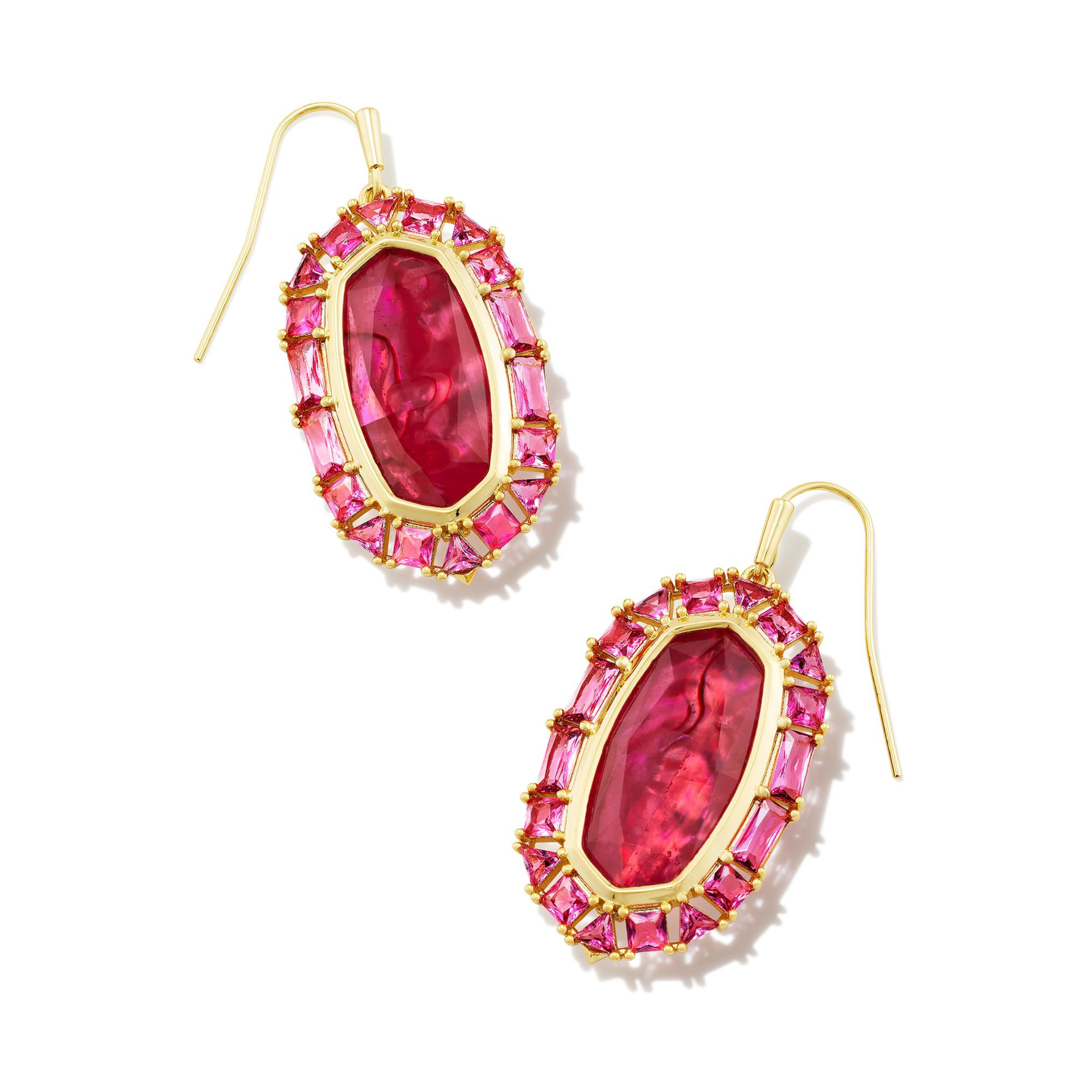 Gold, clear crystal frame drop earrings with raspberry illusion center stone pictured on a white background.