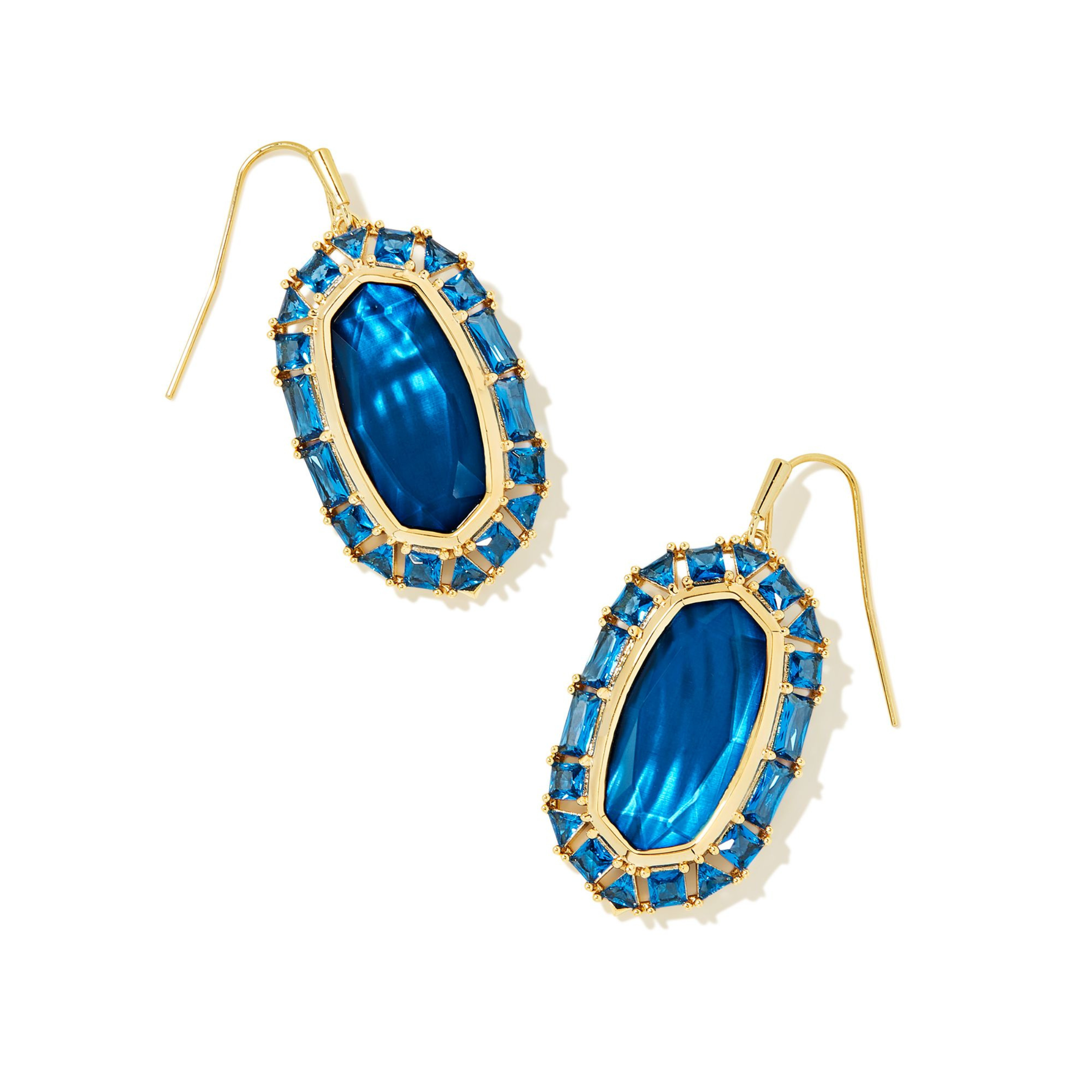 Gold, crystal frame drop earrings with sea blue illusion center stone pictured on a white background.