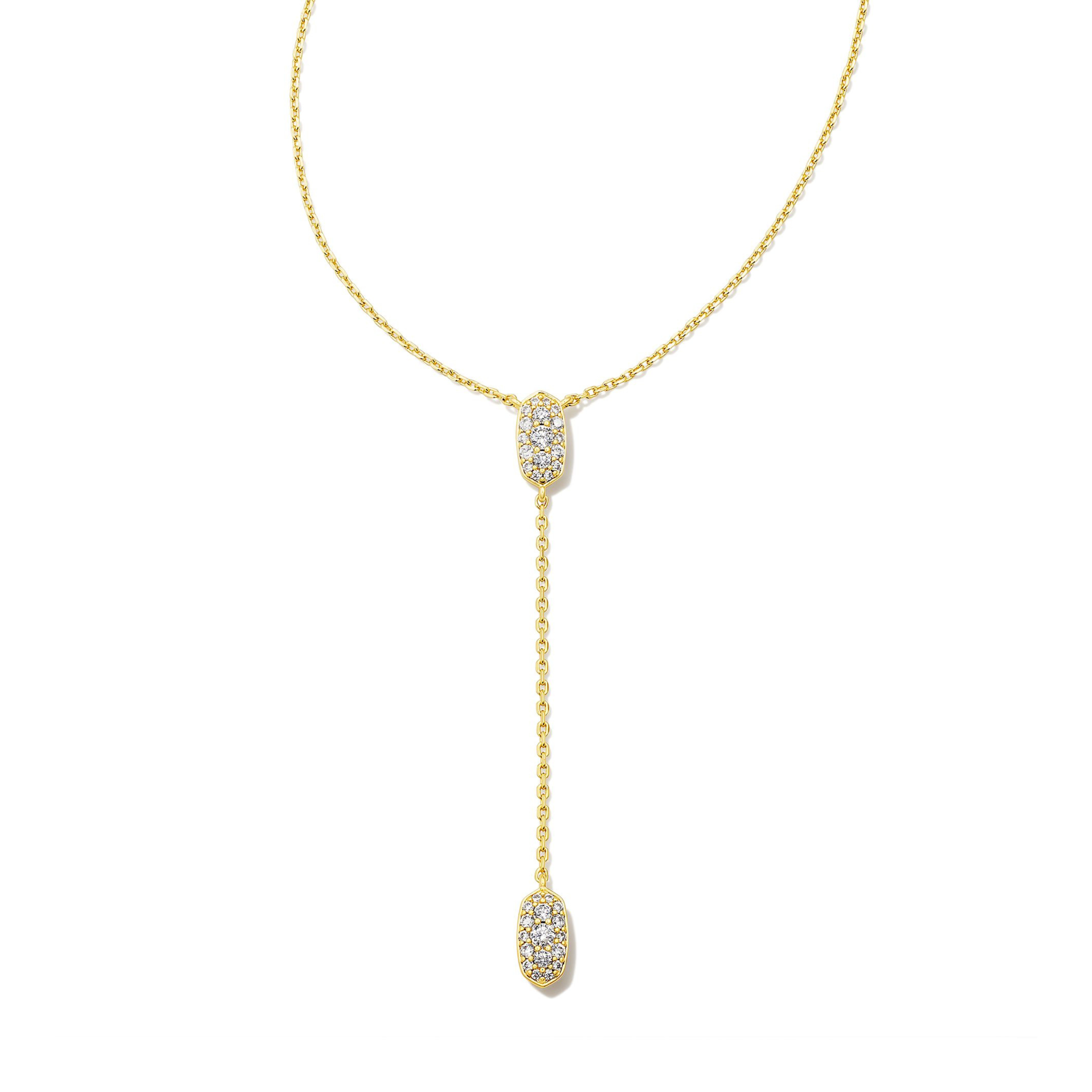 Gold, lariat chain necklace with clear crystals pictured on a white background. 