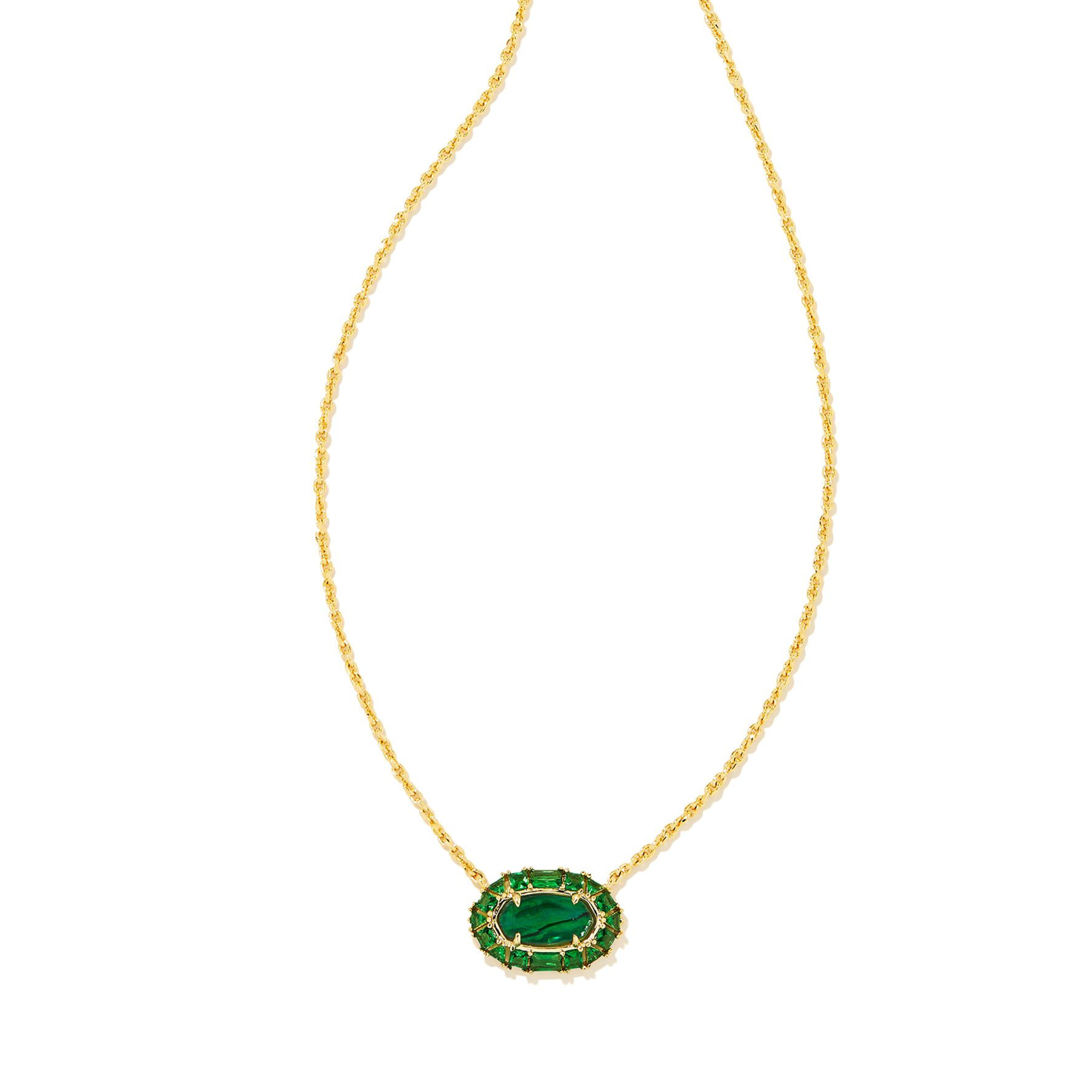 Gold chain necklace with a crystal and kelly green illusion oval pendant pictured on a white background. 
