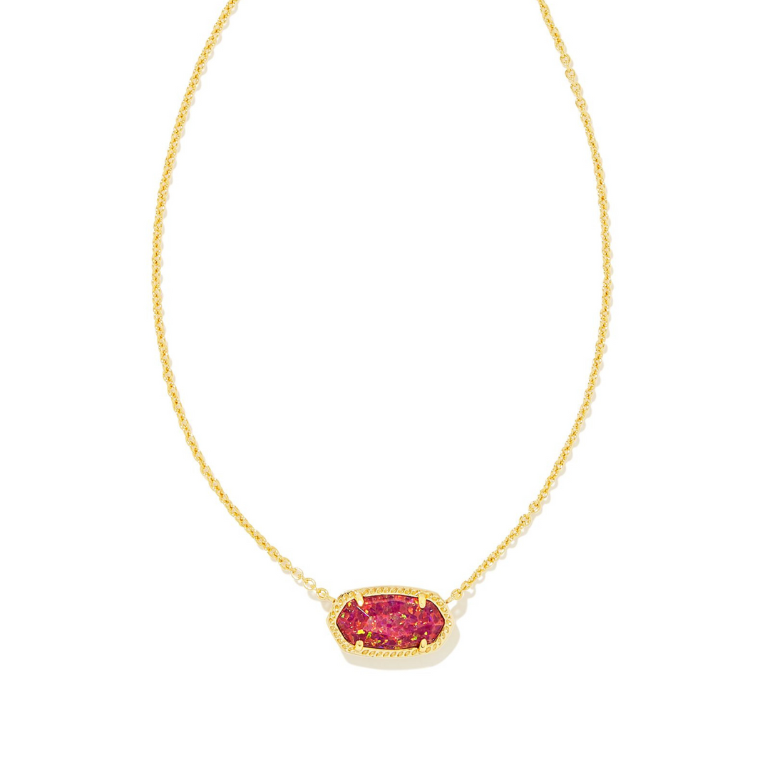 Pictured on a white background is a gold chain necklace with a gold pendant that includes a red opal stone. 