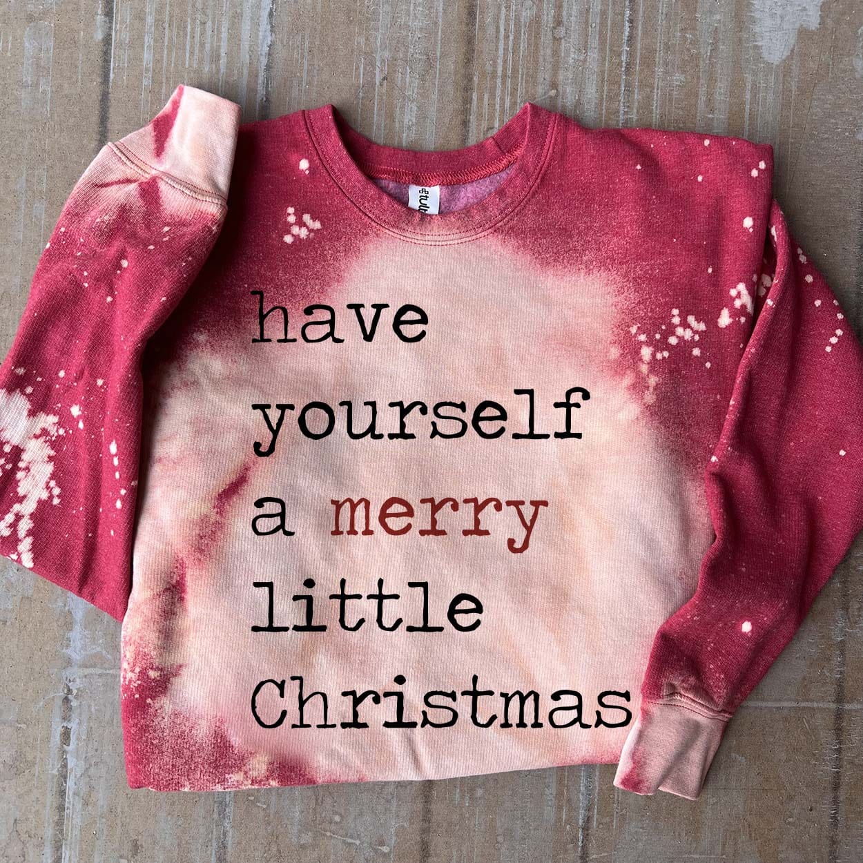 Online Exclusive | Have Yourself A Merry Little Christmas Long Sleeve Bleached Splatter Graphic Sweatshirt in Red - Giddy Up Glamour Boutique
