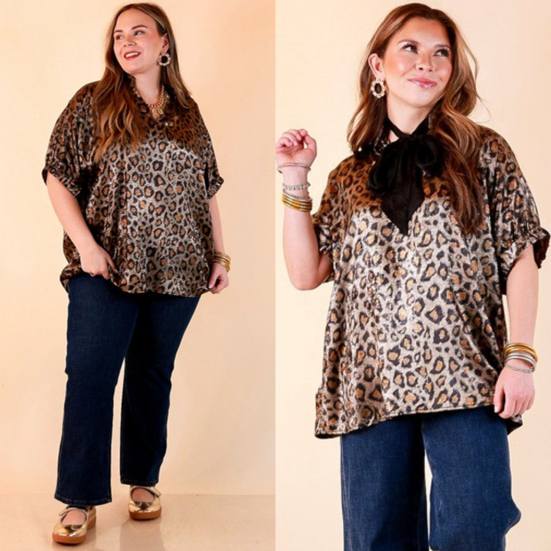 Two images of a woman wearing the Hits the Spot Metallic Leopard Print Short Sleeve Split Neck Top with Ruffle Collar in Black on a beige background