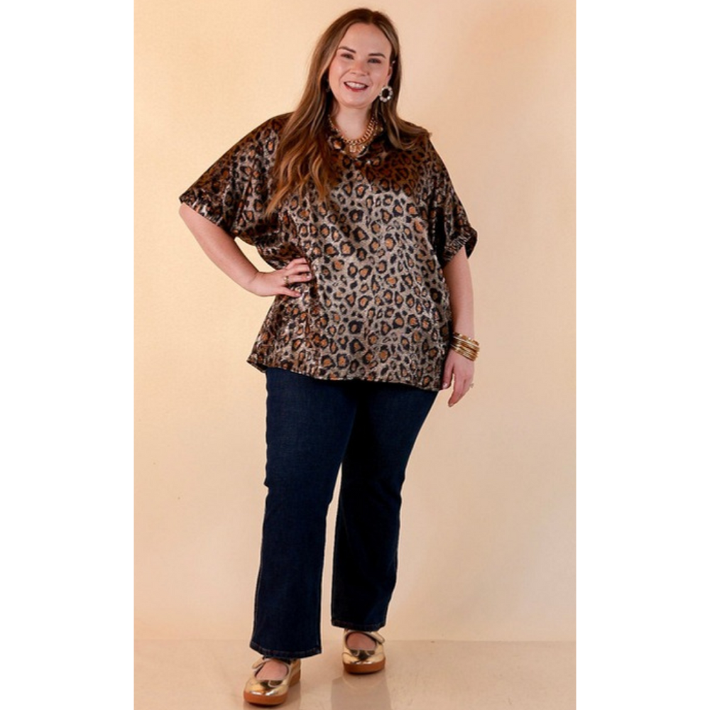 Full length image of a woman wearing the Hits the Spot Metallic Leopard Print Short Sleeve Split Neck Top with Ruffle Collar in Black