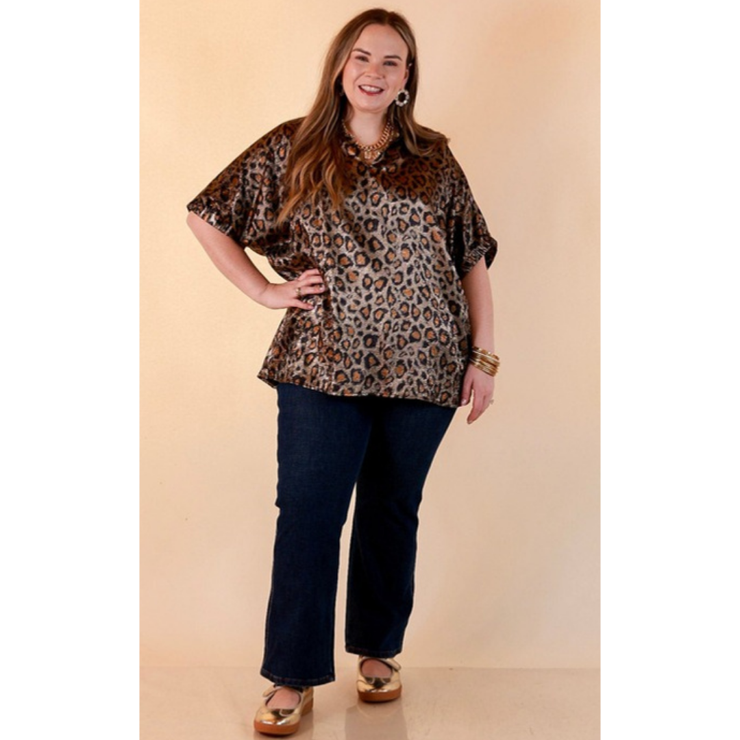 Full length image of a woman wearing the Hits the Spot Metallic Leopard Print Short Sleeve Split Neck Top with Ruffle Collar in Black