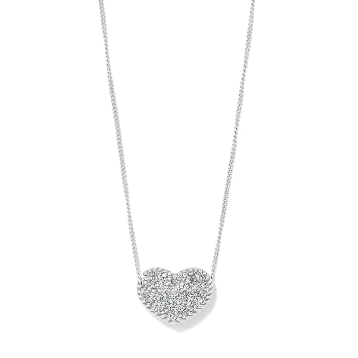 A silver necklace with a heart pendant on a white background