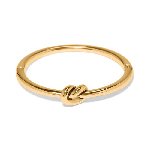 A solid gold knot bracelet by brighton on a solid white background
