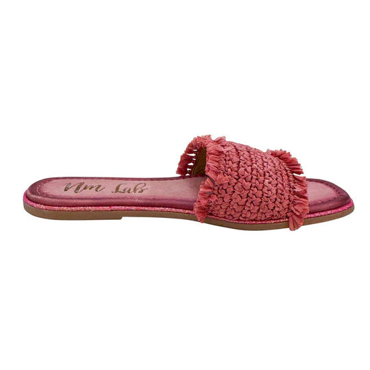 Pink sandal with frayed edges on a white background